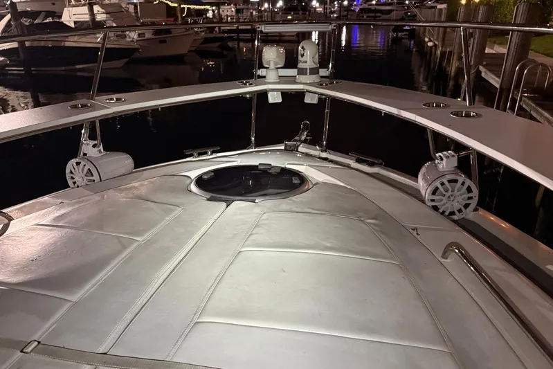 Romaniac Yacht Photos Pics Bow of 2021 Evolve 400HT yacht at night, featuring sleek design and modern equipment.