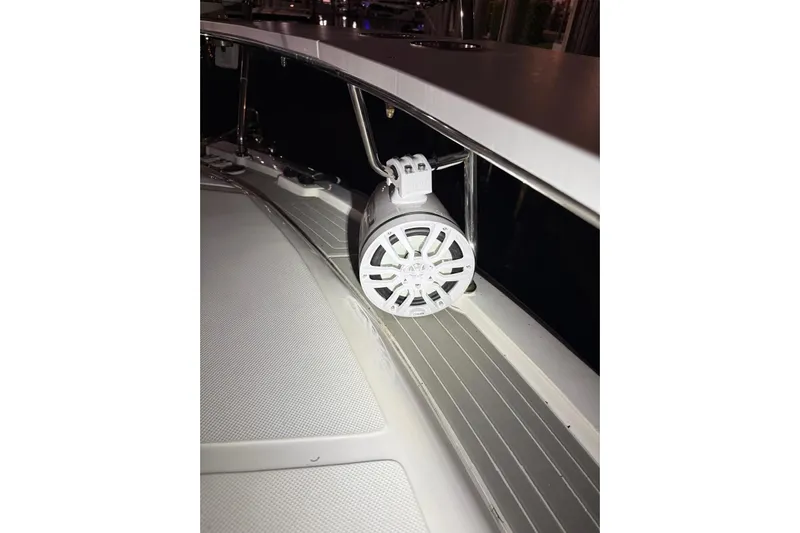 Romaniac Yacht Photos Pics 2021 Evolve 400HT boat with mounted white speaker on deck.