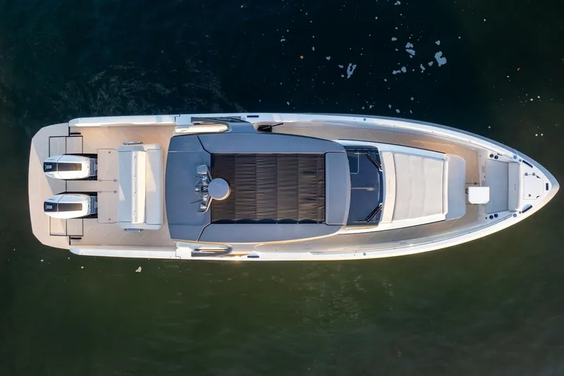  Yacht Photos Pics Aerial view of 2023 Limitless Seas XLV 45 luxury boat on water.