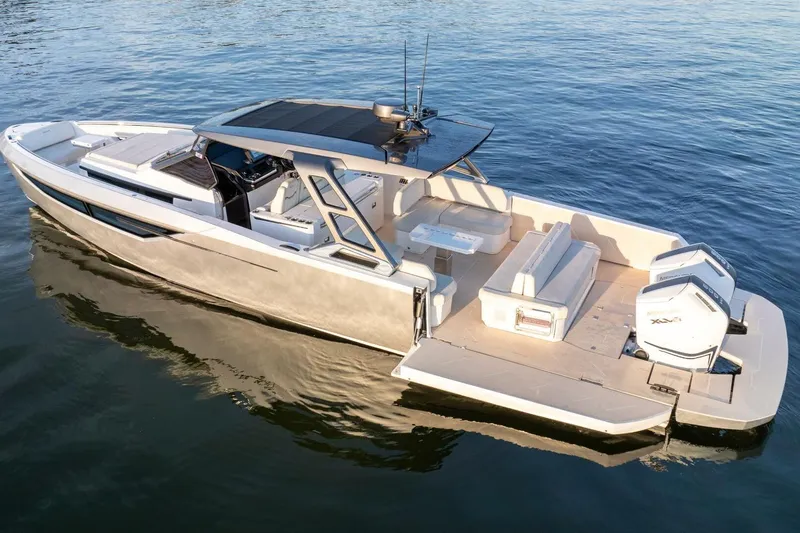  Yacht Photos Pics 2023 Limitless Seas XLV 45 luxury boat on calm water, featuring sleek design and spacious seating.