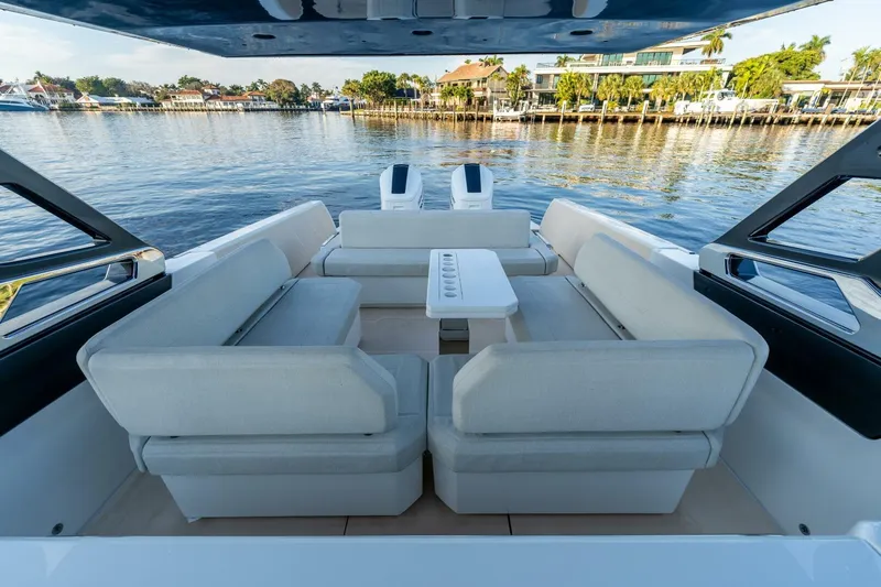  Yacht Photos Pics Luxurious Limitless Seas XLV 45 yacht interior, featuring elegant seating and scenic waterfront view.