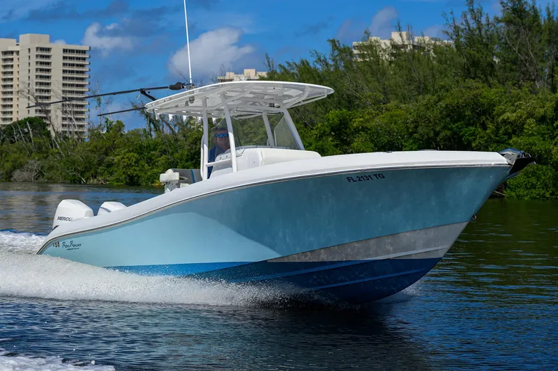  Yacht Photos Pics 2023 Powerplay Powerboats 30 RumRunner cruising on a sunny day.