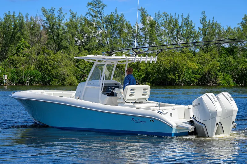  Yacht Photos Pics 2023 Powerplay Powerboats 30 RumRunner on water, featuring dual engines and sleek design.