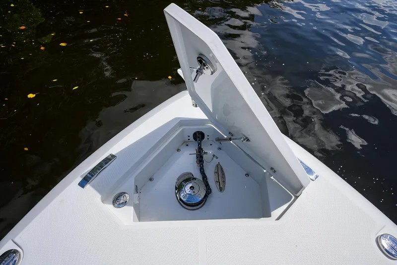 Yacht Photos Pics 2023 Powerplay Powerboats 30 RumRunner anchor compartment open on calm water.