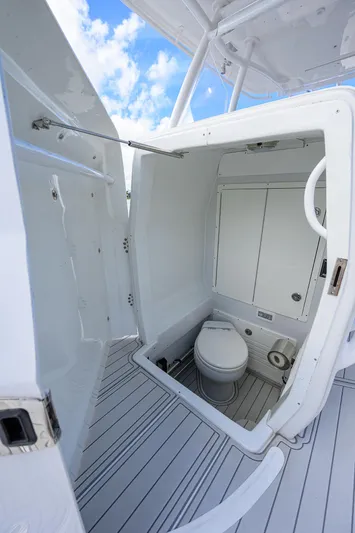  Yacht Photos Pics 2023 Powerplay Powerboats 30 RumRunner bathroom interior with modern amenities.