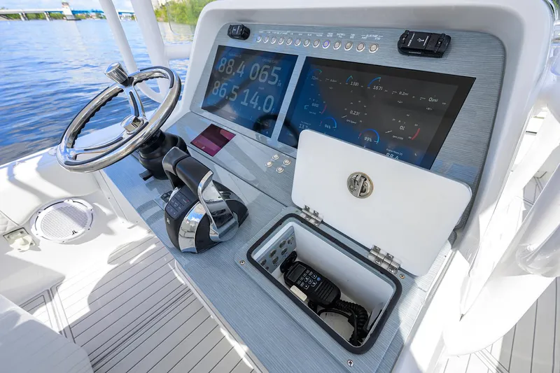  Yacht Photos Pics 2023 Powerplay Powerboats 30 RumRunner dashboard with modern controls and navigation system.