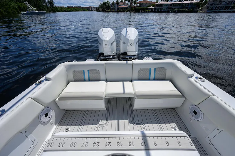  Yacht Photos Pics 2023 Powerplay Powerboats 30 RumRunner with dual engines on a serene lake.