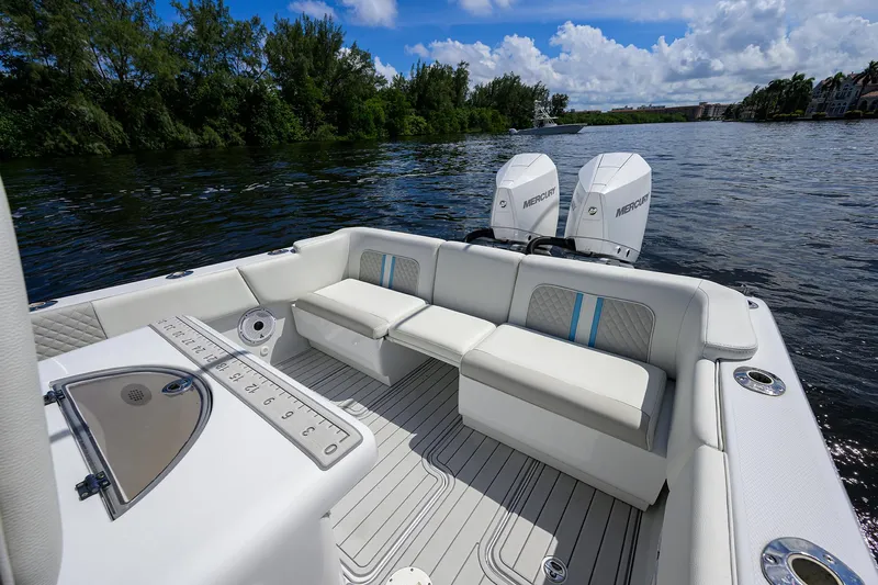  Yacht Photos Pics 2023 Powerplay Powerboats 30 RumRunner on a scenic river with plush seating.