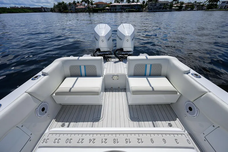  Yacht Photos Pics 2023 Powerplay Powerboats 30 RumRunner with twin engines on a calm lake.