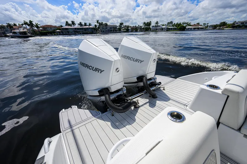  Yacht Photos Pics 2023 Powerplay Powerboats 30 RumRunner with dual Mercury engines on water.