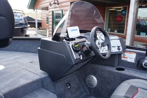 2026 Tracker Pro Guide V-175 WT boat interior with steering wheel and dashboard controls.