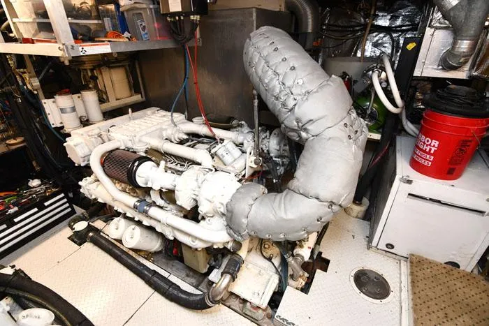  Yacht Photos Pics Engine room of 1997 Forbes Cooper 74 Pilothouse yacht, showcasing machinery and equipment.