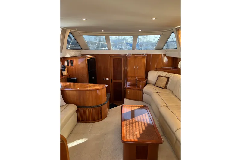 Minnow Yacht Photos Pics Luxurious interior of 2006 Carver 39 Motor Yacht with elegant wood finishes and plush seating.