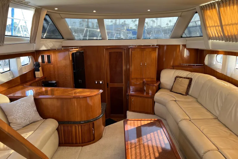 Minnow Yacht Photos Pics Luxurious interior of 2006 Carver 39 Motor Yacht with elegant wood finishes and plush seating.