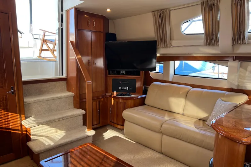 Minnow Yacht Photos Pics Luxurious interior of 2006 Carver 39 Motor Yacht with plush seating and entertainment area.