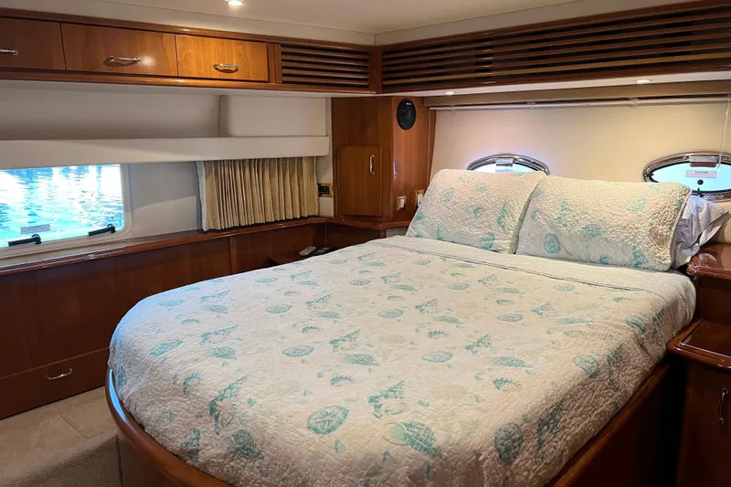 Minnow Yacht Photos Pics Luxurious bedroom interior of 2006 Carver 39 Motor Yacht with elegant bedding.