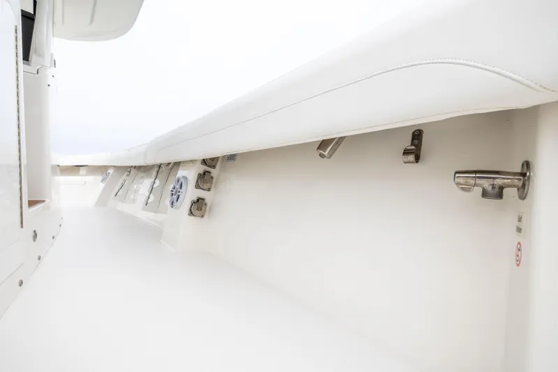 Comin In Reel Hot Yacht Photos Pics 2023 Regulator 37 boat interior detail, showcasing sleek white design and hardware.