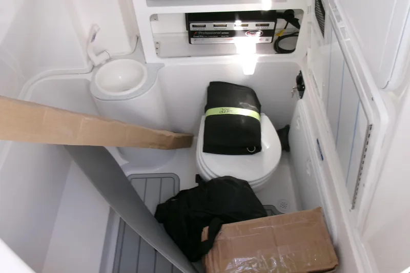 Look At This Boat! Wow! Yacht Photos Pics Interior of 2026 Sea Fox 288 Commander boat with toilet and storage items.