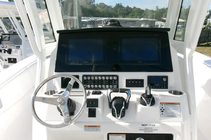 Look At This Boat! Wow! Yacht Photos Pics 2026 Sea Fox 288 Commander helm with dual screens and modern controls.