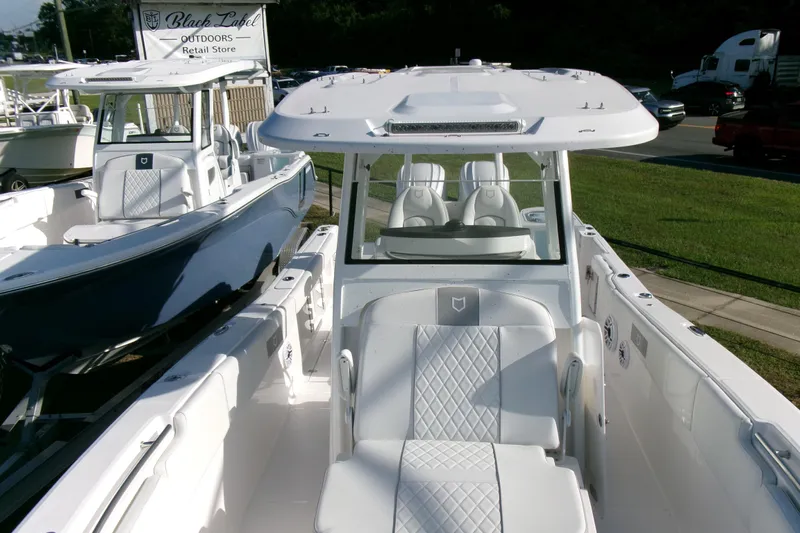 Look At This Boat! Wow! Yacht Photos Pics 2026 Sea Fox 288 Commander boat with white interior at outdoor retail store.