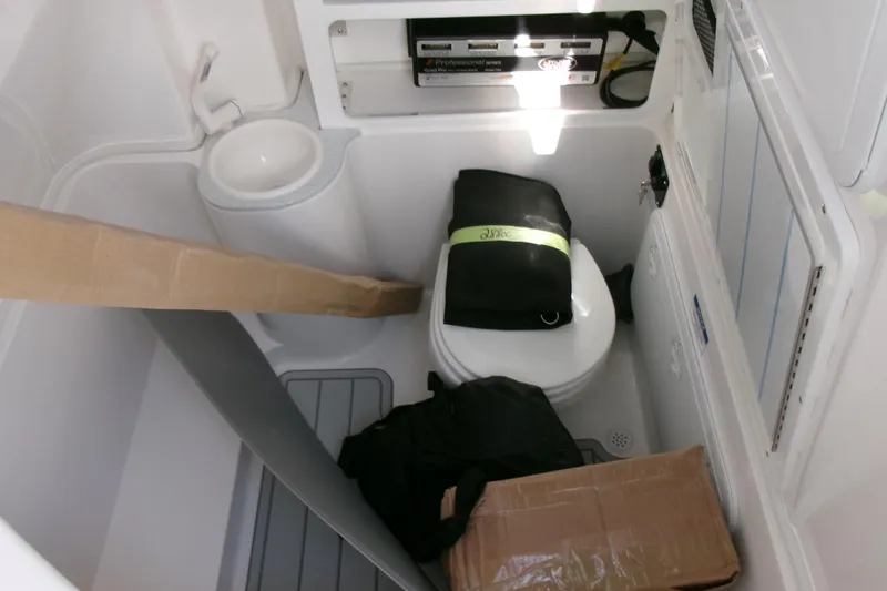 Look At This Boat! Wow! Yacht Photos Pics Interior of 2026 Sea Fox 288 Commander boat with storage and toilet area.