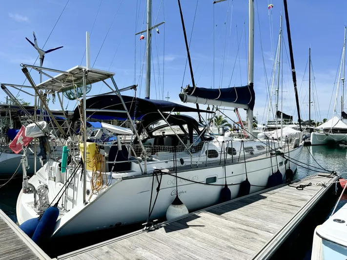  Yacht Photos Pics Beneteau Oceanis 473 sailboat docked at marina, 2006 model, sunny day.