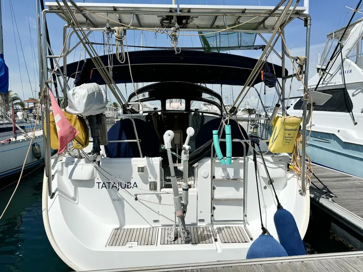  Yacht Photos Pics 2006 Beneteau Oceanis 473 sailboat docked at marina, rear view.