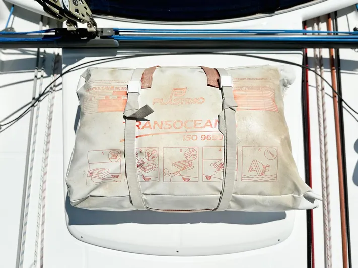  Yacht Photos Pics Life raft on 2006 Beneteau Oceanis 473 sailboat deck, secured with straps.