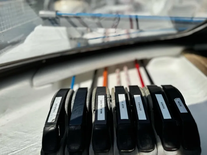  Yacht Photos Pics Control panel on 2006 Beneteau Oceanis 473 sailboat, featuring labeled rope clutches.