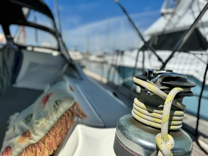  Yacht Photos Pics 2006 Beneteau Oceanis 473 sailboat deck with winch and ropes, docked at marina.