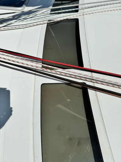  Yacht Photos Pics Close-up of 2006 Beneteau Oceanis 473 deck with ropes and windows.