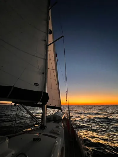  Yacht Photos Pics Sailing at sunset on a 2006 Beneteau Oceanis 473 yacht.