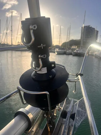  Yacht Photos Pics Close-up of a 2006 Beneteau Oceanis 473 sailboat's furling system at sunset in a marina.