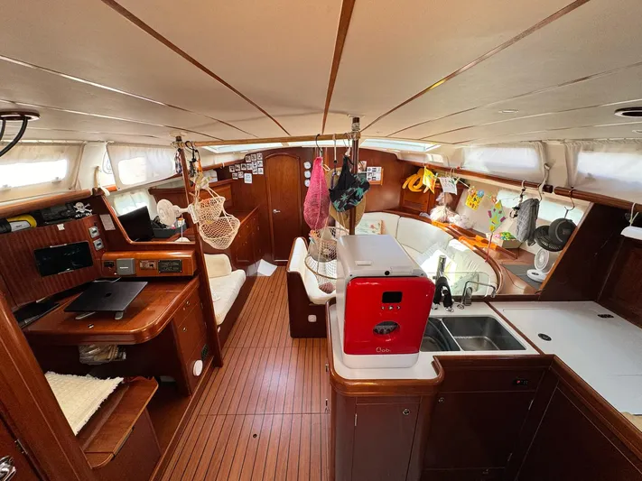  Yacht Photos Pics Interior of 2006 Beneteau Oceanis 473 sailboat with wood finish and modern amenities.