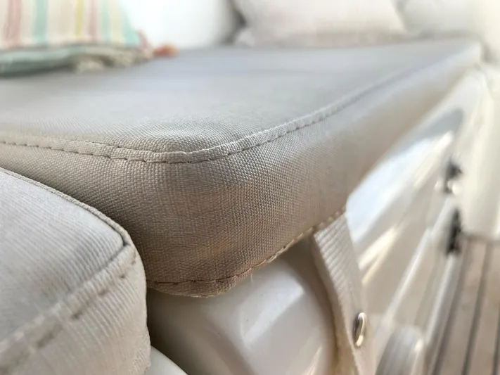  Yacht Photos Pics Cushioned seating on 2006 Beneteau Oceanis 473 yacht, showcasing comfortable upholstery.