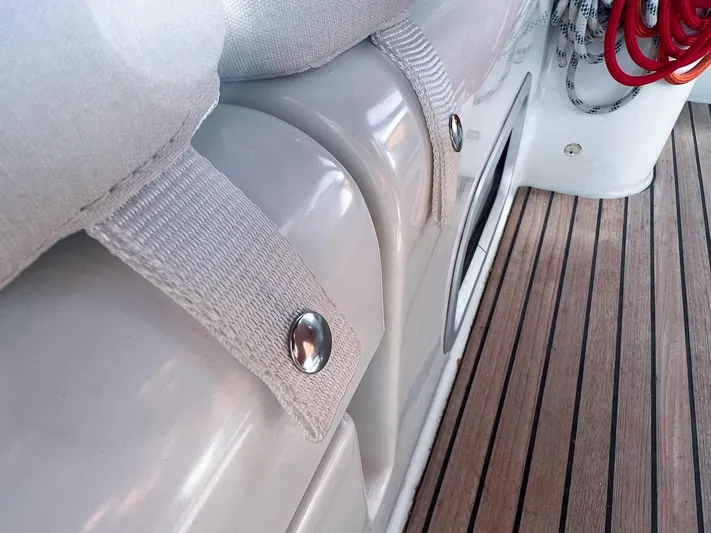  Yacht Photos Pics Beneteau Oceanis 473 yacht deck detail with white straps and wooden flooring, 2006 model.