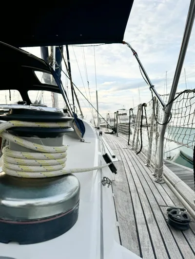  Yacht Photos Pics 2006 Beneteau Oceanis 473 sailboat deck with winch and rope, docked at marina.