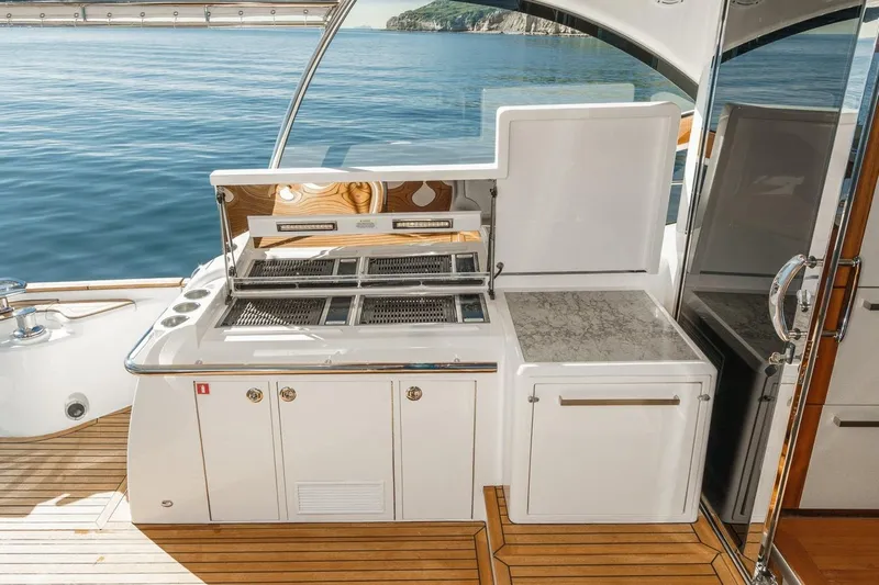 Valencia Yacht Photos Pics Outdoor kitchen on 2019 Belize 66 Sedan yacht with ocean view.