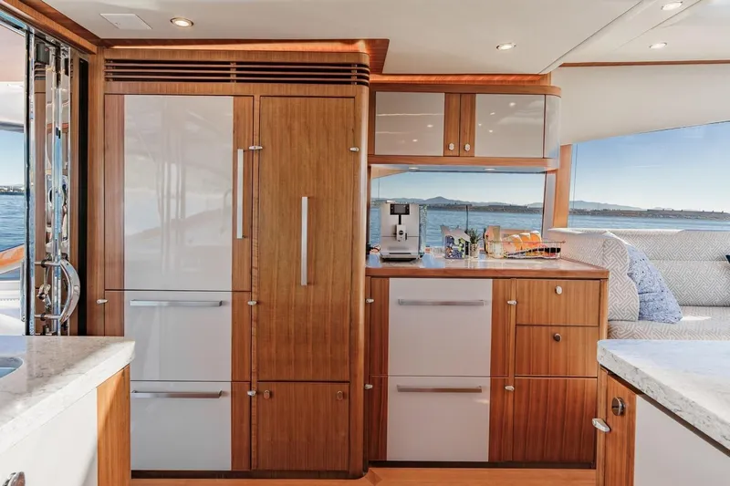 Valencia Yacht Photos Pics Luxurious interior of 2019 Belize 66 Sedan yacht with modern kitchen and ocean view.