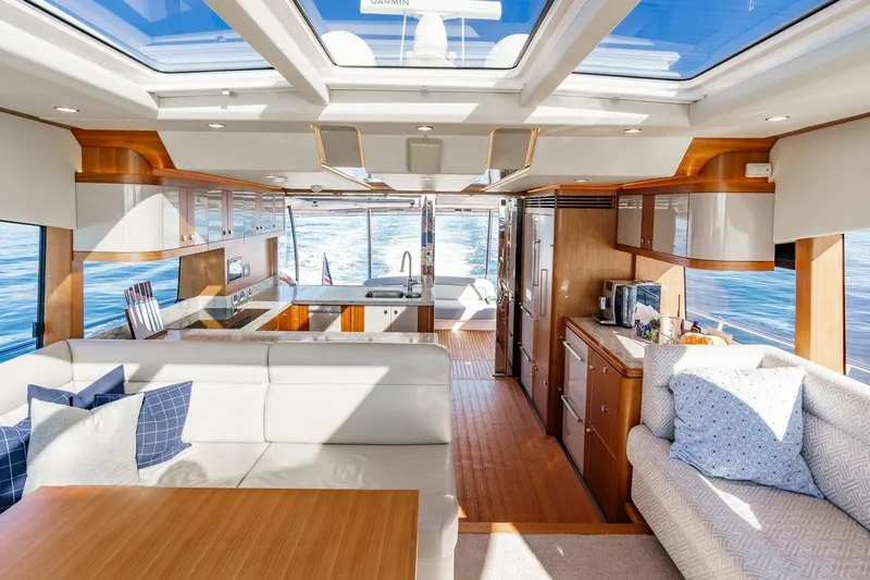 Valencia Yacht Photos Pics Luxurious interior of 2019 Belize 66 Sedan yacht with modern furnishings and ocean view.