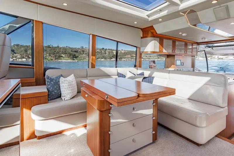 Valencia Yacht Photos Pics Luxurious interior of 2019 Belize 66 Sedan yacht with elegant seating and scenic ocean views.