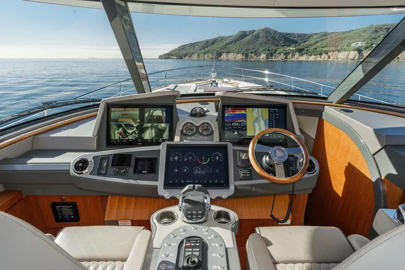 Valencia Yacht Photos Pics Luxurious 2019 Belize 66 Sedan yacht cockpit with advanced navigation systems and scenic ocean view.