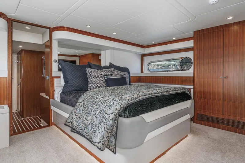 Valencia Yacht Photos Pics Luxurious bedroom interior of 2019 Belize 66 Sedan yacht with elegant wood finishes.