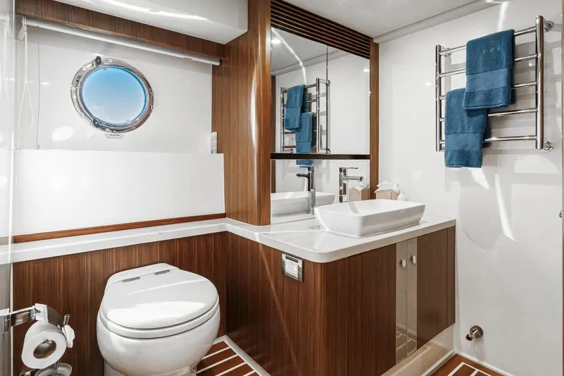 Valencia Yacht Photos Pics Luxurious bathroom in 2019 Belize 66 Sedan yacht with modern fixtures and porthole window.