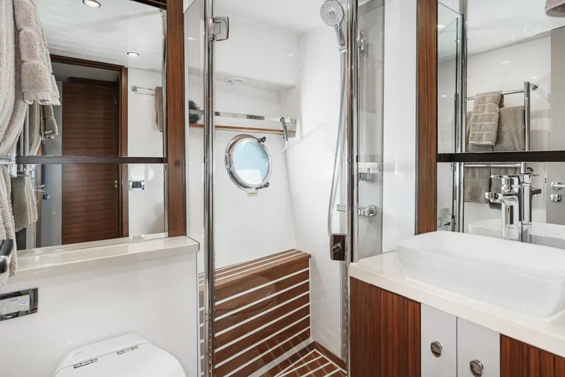 Valencia Yacht Photos Pics Luxurious bathroom in 2019 Belize 66 Sedan yacht with modern fixtures and wooden accents.
