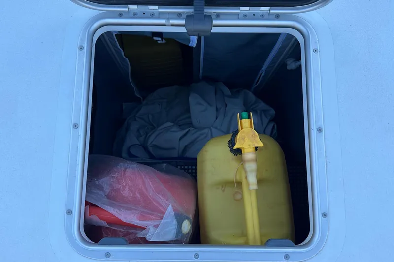 Gtfo Yacht Photos Pics Open storage compartment with yellow fuel can and red container, Balance 482, 2023 model.