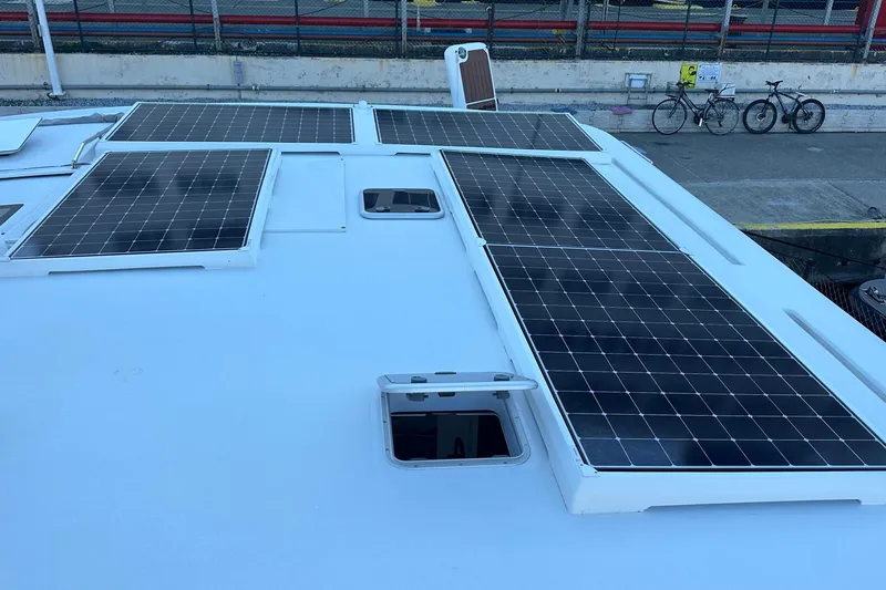 Gtfo Yacht Photos Pics Rooftop solar panels on a 2023 Balance 482 catamaran, dockside with bicycles nearby.