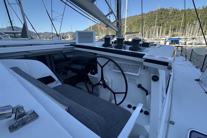 Gtfo Yacht Photos Pics Cockpit of 2023 Balance 482 yacht with Garmin navigation, docked in a scenic marina.