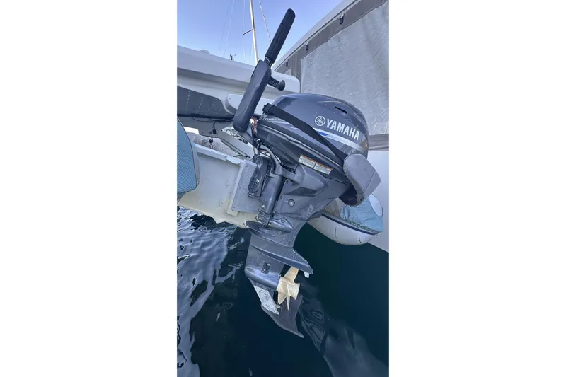 Gtfo Yacht Photos Pics Outboard motor on a Balance 482 boat, 2023 model, docked on calm water.