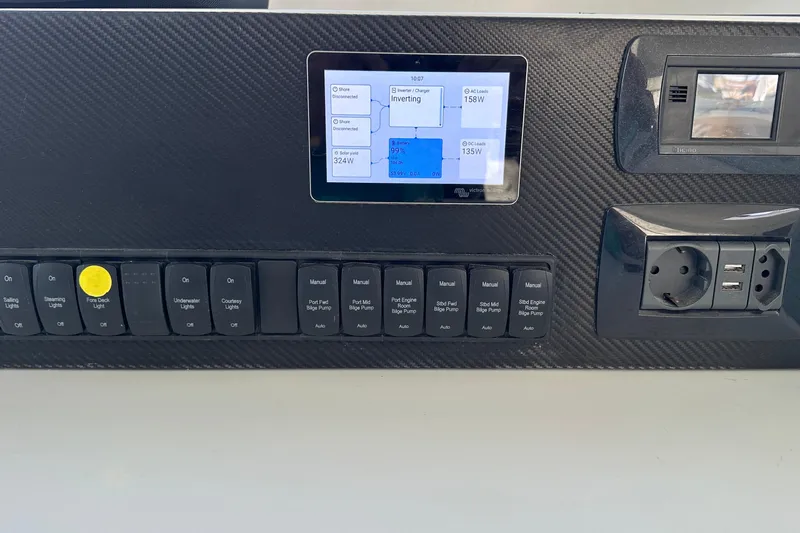 Gtfo Yacht Photos Pics Control panel of Balance 482 yacht, featuring switches, touchscreen, and power outlets, 2023 model.